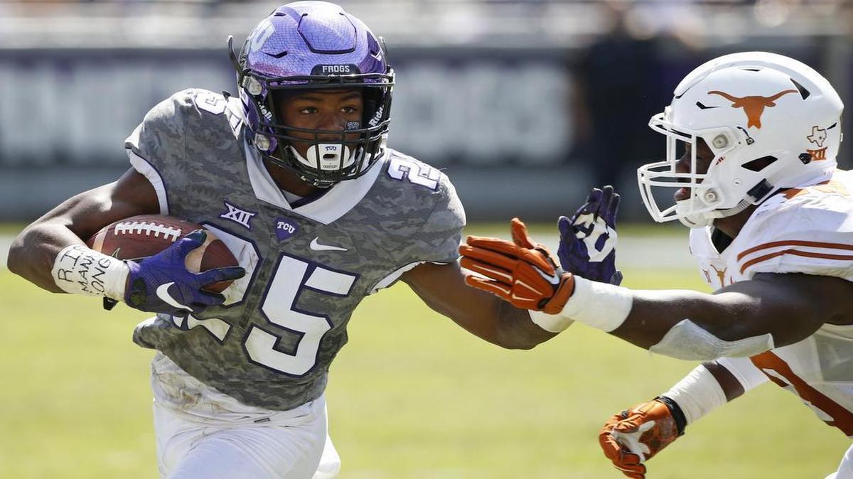 
TCU receiver KaVontae Turpin makes a move to get outside against Texas linebacker Peter Jinkens during last week’s game in Fort Worth. Turpin, an elusive 152-pound speedster from Monroe, La., caught a Big 12 freshman record four touchdown passes in the Horned Frogs’ 50-7 victory.

