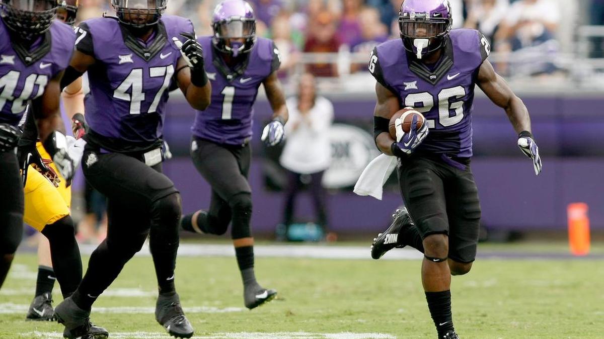 TCU safety Derrick Kindred, right, said he grew up watching Oregon football games. On Saturday in San Antonio, he’ll play in one.
