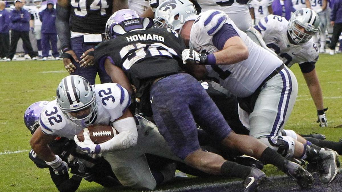 Kansas State running back Justin Silmon (32) followed his blockers for 133 yards and two touchdowns against TCU.