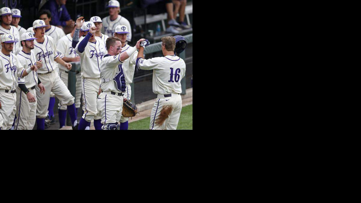 
TCU’s Connor Wanhanen is welcomed back t the dugout after scoring in the first inning as the Baylor Bears played the TCU Horned Frogs in NCAA baseball Sunday March 15, 2015 in Fort Worth, Texas. TCU defeated Baylor 10-1.
