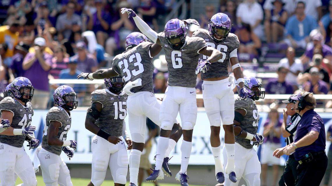 TCU safety Innis Gaines (6) is congratulated by teammates following an interception during the first half against Southern University on Saturday at Amon G. Carter Stadium.