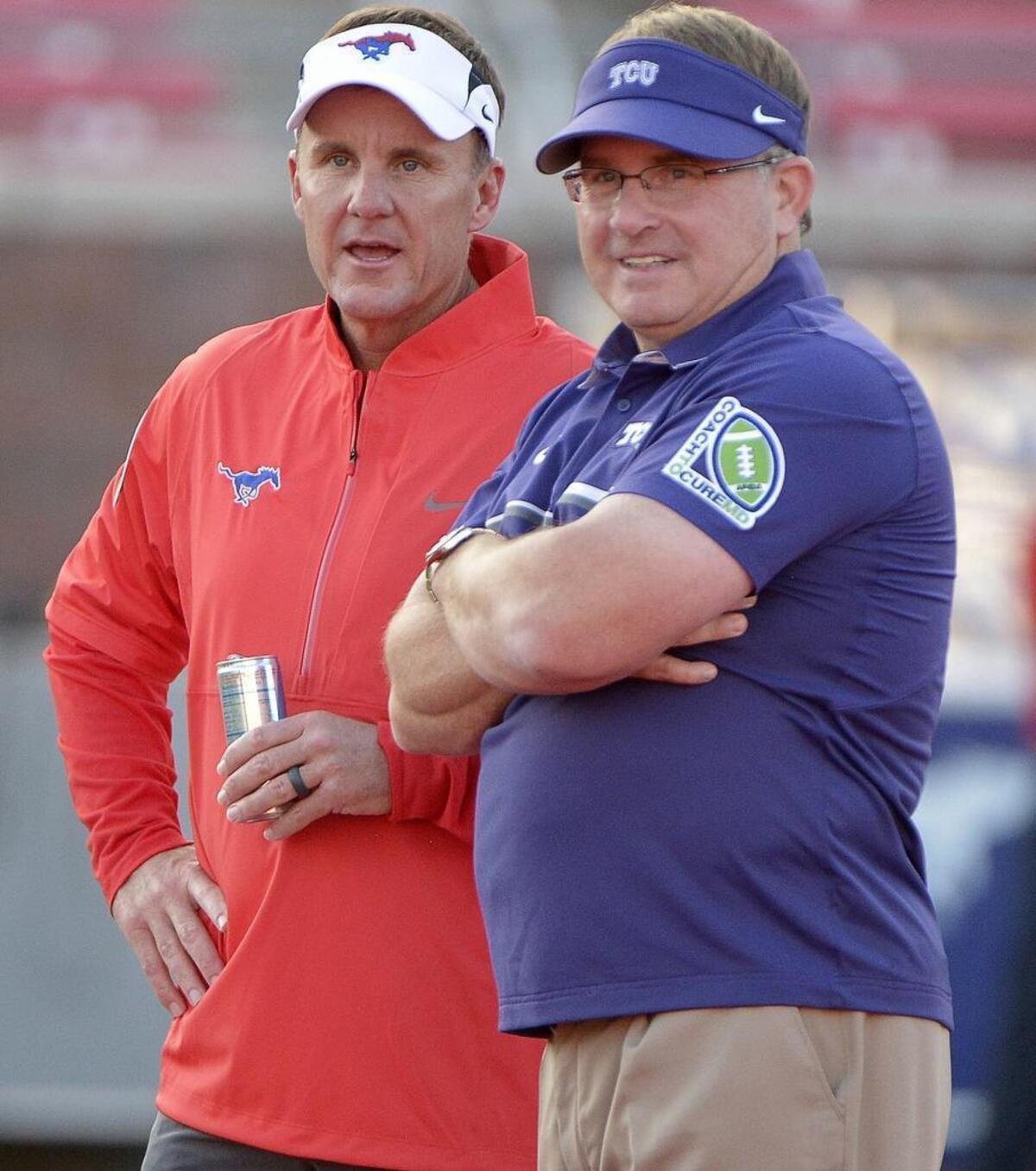 SMU head coach Chad Morris, left, and TCU head coach Gary Patterson talk before the game in September 2016.