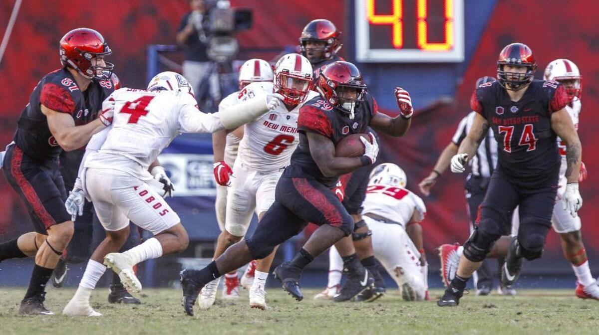 Former Kennedale star and current San Diego State running back Juwan Washington carries the ball for a 60-yard touchdown in the fourth quarter against New Mexico at SDCCU Stadium in San Diego on Friday, Nov. 24, 2017. The host Aztecs won, 35-10.