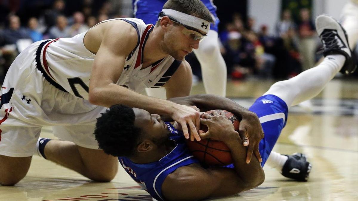 UTA guard Kaelon Wilson, right, in action earlier this season against Saint Mary’s, scored 11 points Saturday as one of six players in double figures for the Mavericks in their 90-69 victory over Coastal Carolina.