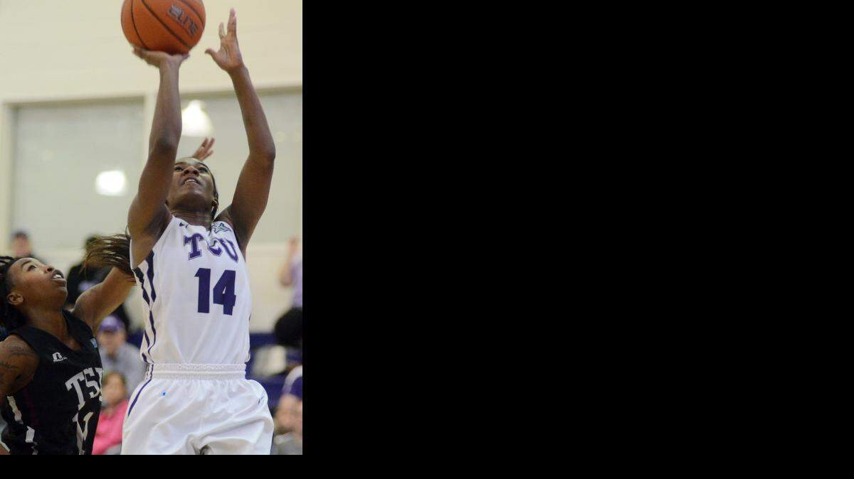 
TCU’s Zahna Medley, right, takes the shot underneath the basket before Texas Southern University’s Diamonisha Sophus can block during the second half Saturday’s, November 22, 2014 basketball game at the University Recreation Center in Fort Worth. TCU went on to win. Special/Bob Haynes
