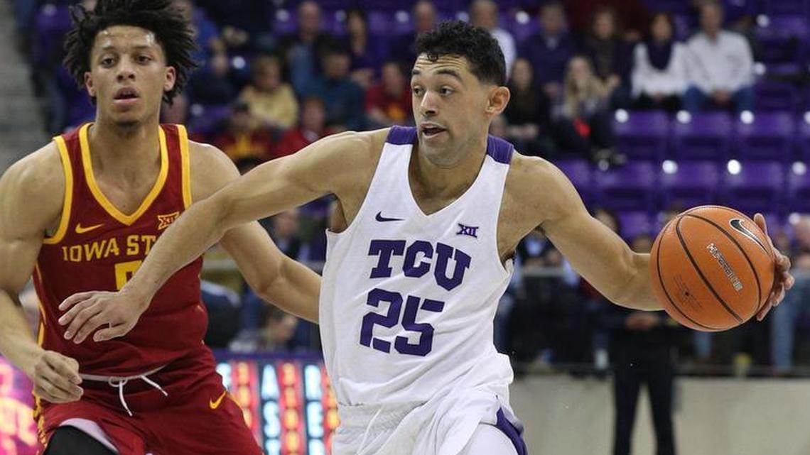 TCU guard Alex Robinson moves the ball past Iowa State guard Lindell Wigginton in the second half of an NCAA basketball game Wednesday, January 17, 2018. TCU beat Iowa State 96-73.