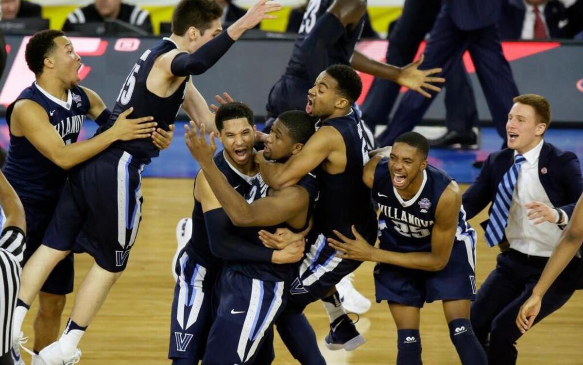 Villanova players celebrate after Kris Jenkins, center, hits a 3-pointer just before the buzzer Monday night.