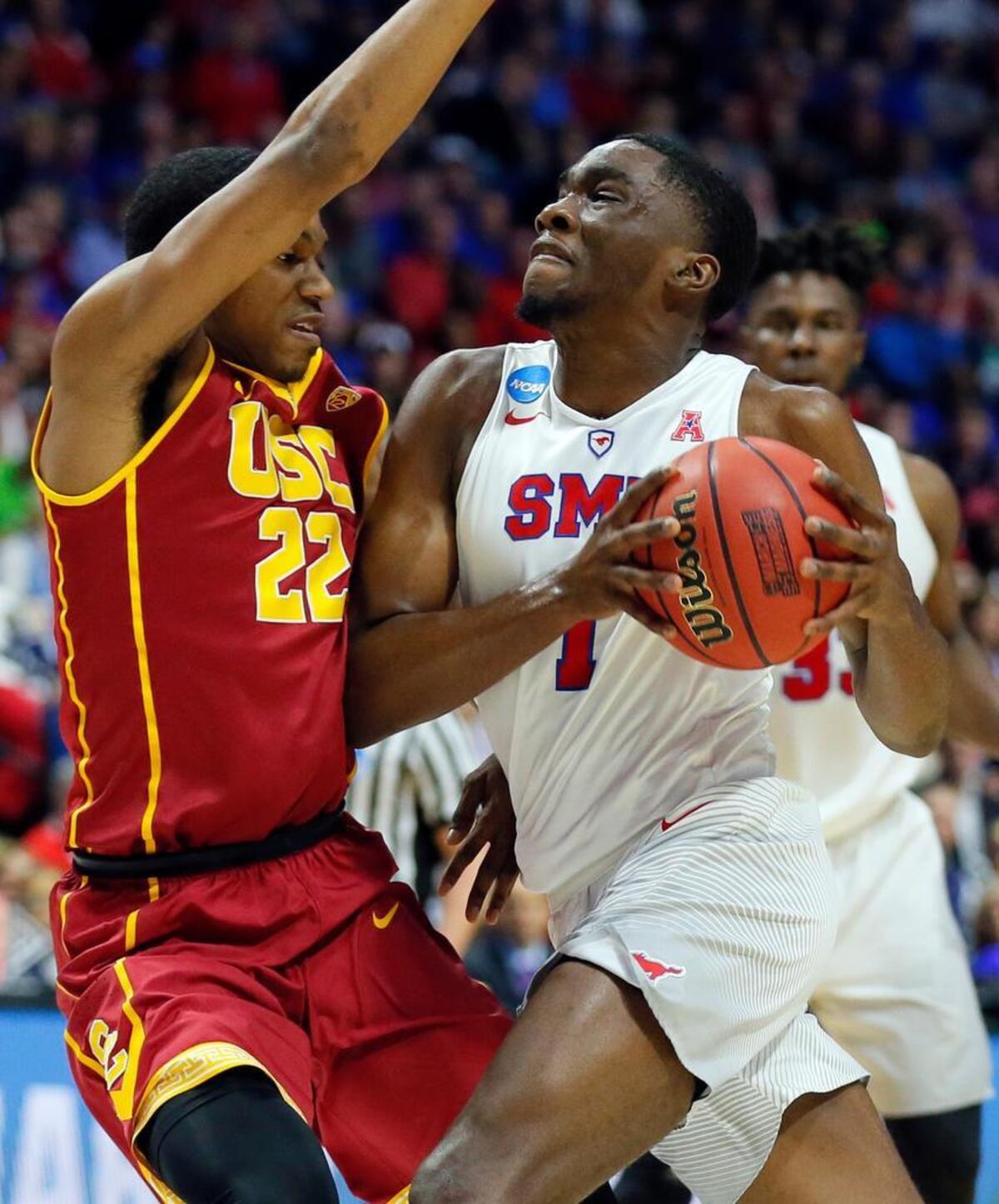 Southern California’s De’Anthony Melton (22) defends against a drive to the basket by SMU’s Shake Milton (1) in the first half of a first-round game in the men’s NCAA college basketball tournament in Tulsa, Okla., Friday March 17, 2017.