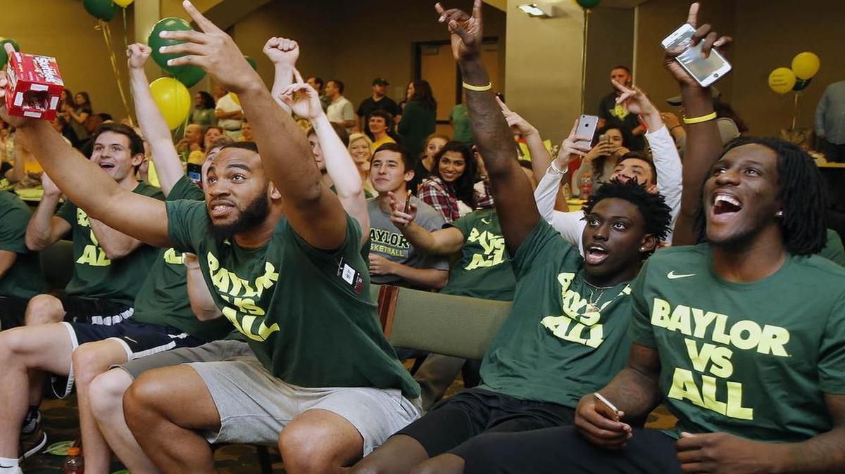 Baylor forward Rico Gathers, left, celebrates with Johnathan Motley and Taurean Prince, right, during the NCAA tournament selection show in Waco, Texas, Sunday.