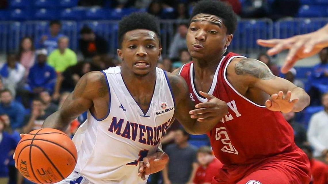 UTA guard Erick Neal, left, against Bradley earlier this season, scored a team-high 22 points Saturday in a 93-71 loss at Troy.