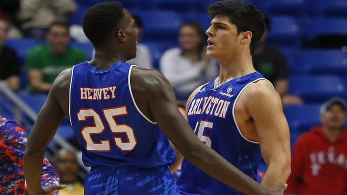 UTA’s Kevin Hervey, left, and Jorge Bilbao celebrate a basket with a chest bump.