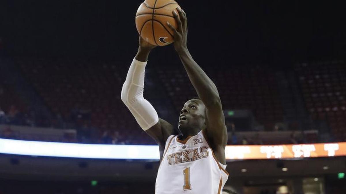 Texas guard Andrew Jones drives to the basket during a game in November.