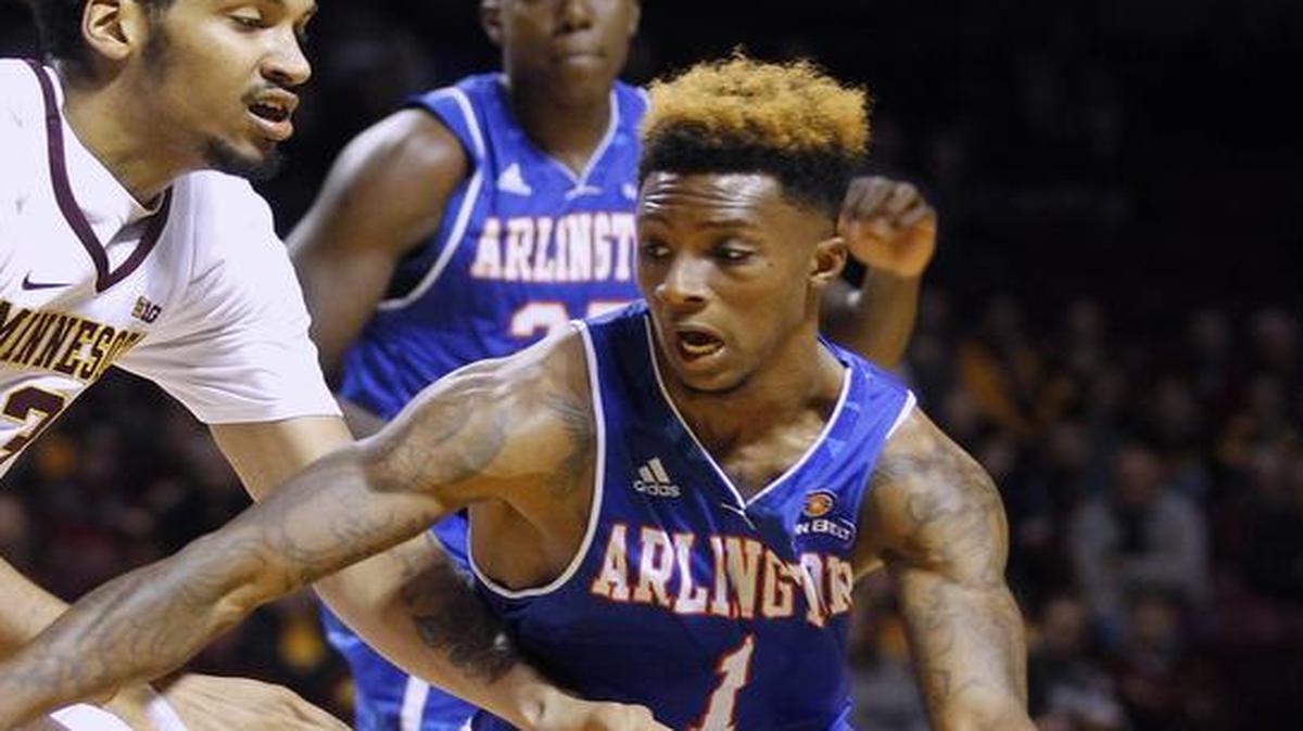 UT Arlington guard Erick Neal, right, driving on Minnesota forward Jordan Murphy in a game Nov. 14, had 15 points and 13 assists Monday night against University of Texas at Dallas. The Mavericks beat UTD 99-49.