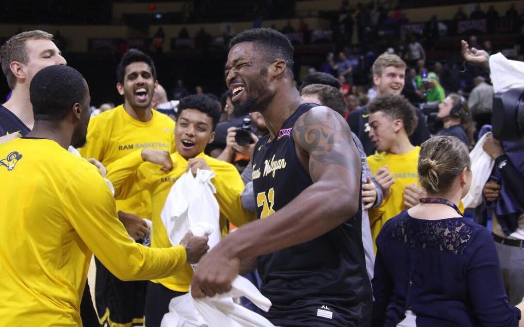 Najeal Young celebrates with Texas Wesleyan teammates after their victory Tuesday for the NAIA championship.