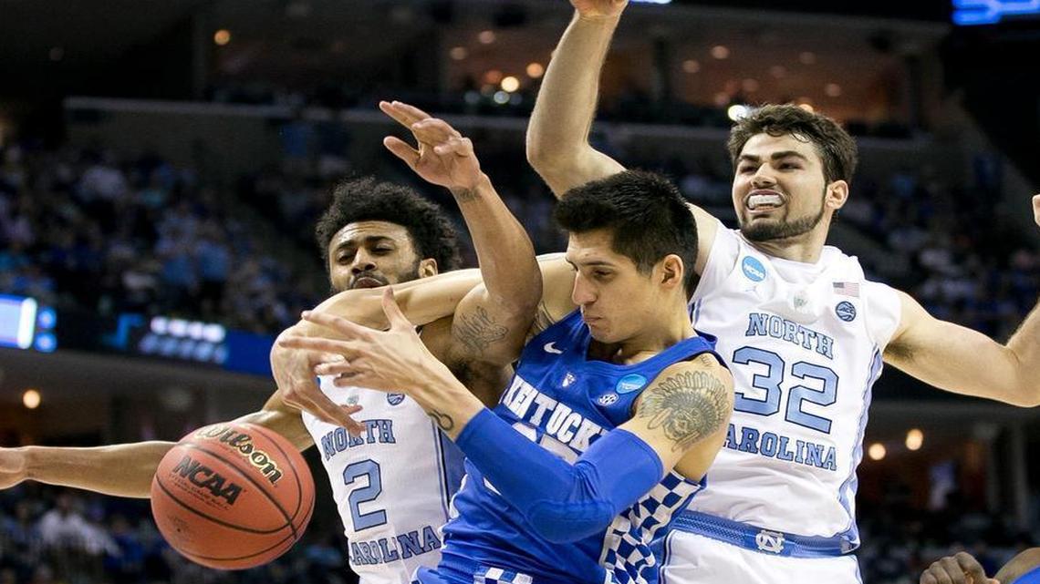 North Carolina’s Joel Berry II (2) and Luke Maye (32) battles for a rebound with Kentucky’s Derek Willis (35) during the first half of the NCAA Tournament South Regional final on Sunday, March 26, 2017 at FedExForum in Memphis, Tenn.