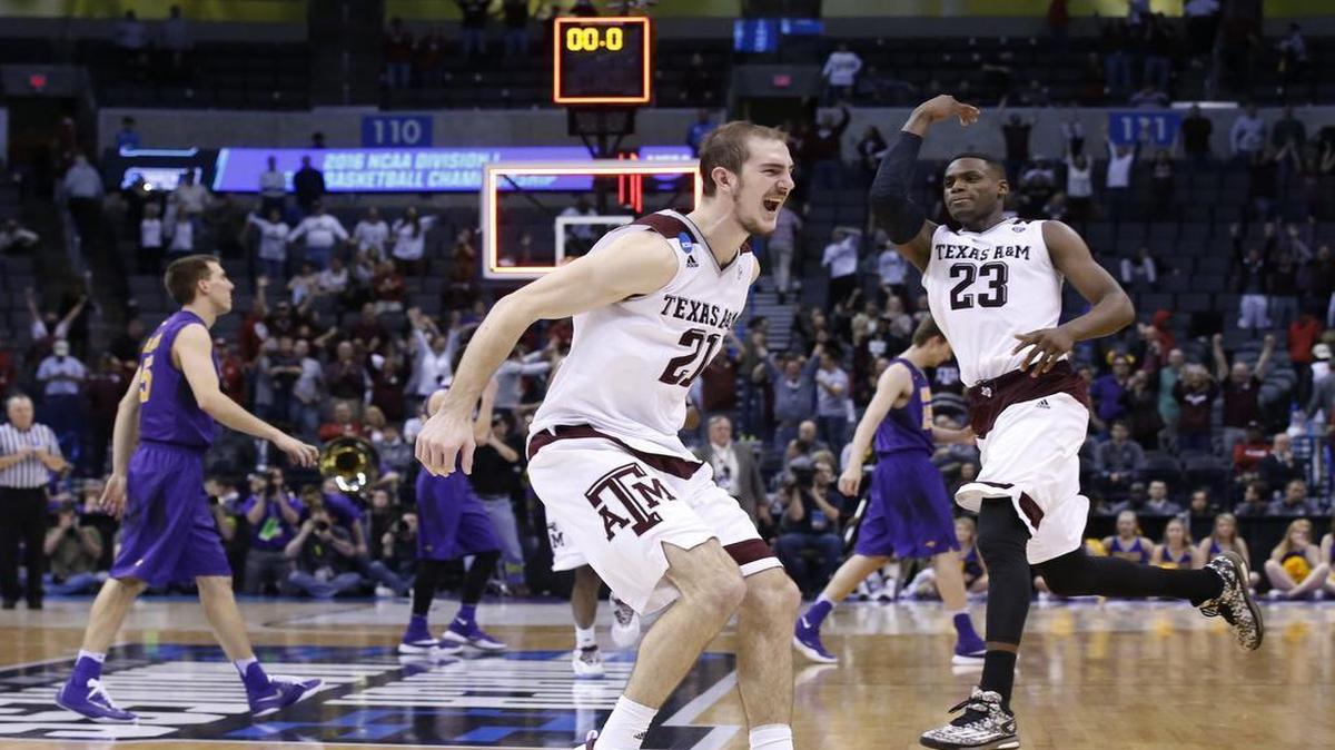 Alex Caruso, left, and Danuel House of Texas A&M celebrate following the Aggies’ improbable comeback victory against Northern Iowa.