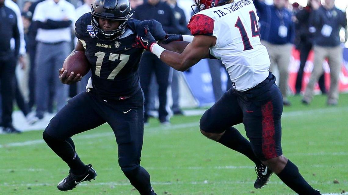 Army quarterback Ahmad Bradshaw (17) tries to break free from San Diego State safety Tariq Thompson (14) during the first half, Saturday, December 23, 2017 in the Armed Forces Bowl played at Amon Carter Stadium in Fort Worth, TX.
