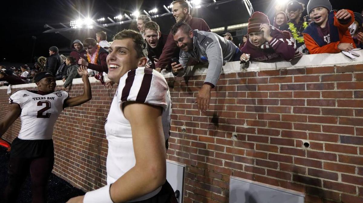 Texas A&M quarterback Nick Starkel (17) is congratulated by fans following a 31-24 win over Mississippi in an NCAA college football game in Oxford, Miss., Saturday, Nov. 18, 2017.