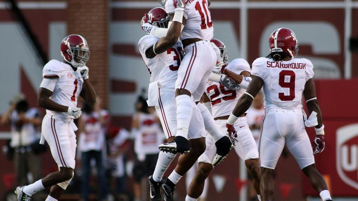 Alabama’s Reuben Foster (10) and Mack Wilson (30) celebrate after a turnover during the second quarter of an NCAA college football game against Arkansas on Saturday, Oct. 8, 2016, in Fayetteville, Ark. Alabama won 49-30.