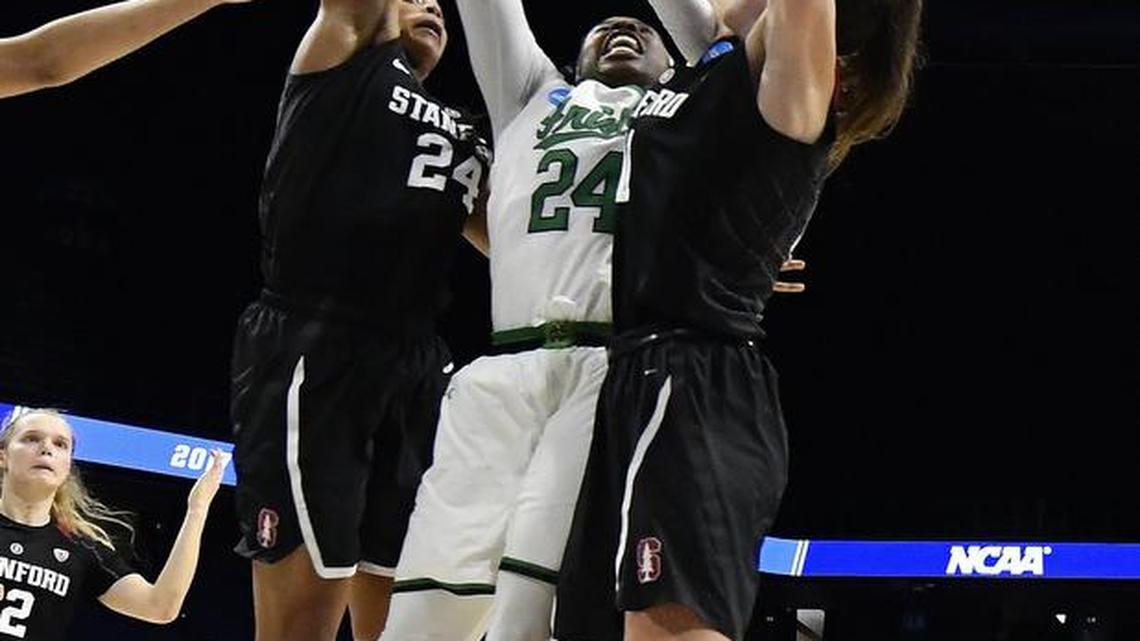 Stanford’s Erica McCall, left, blocks a game-winning shot attempt from Notre Dame’s Arike Ogunbowale in the closing seconds Sunday in Lexington, Ky.