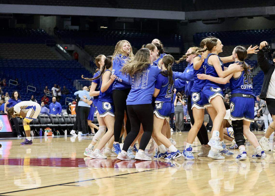 The Decatur Eagles celebrate their 58-54 overtime victory against Waco La Vega in the Class 4A Division I state championship on Friday at the Alamodome in San Antonio.