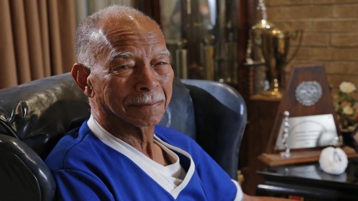 Retired Dunbar basketball coach Robert Hughes Sr. at his Fort Worth home this week. He is expected to head to San Antonio this week to watch his son coach lead the Wildcats at the state tournament.