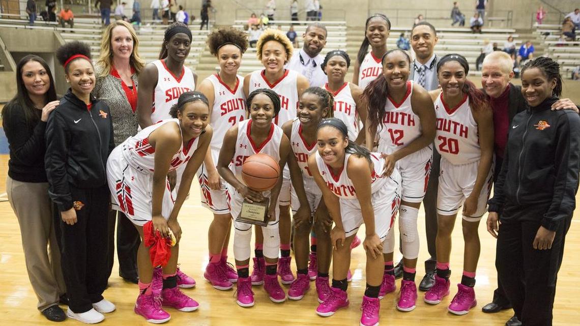 South Grand Prairie players and coaches savor the win after the Warriors’ 61-35 Class 6A bi-district playoff victory over Hurst L. D. Bell on Feb. 16, 2016, at Grand Prairie High School.