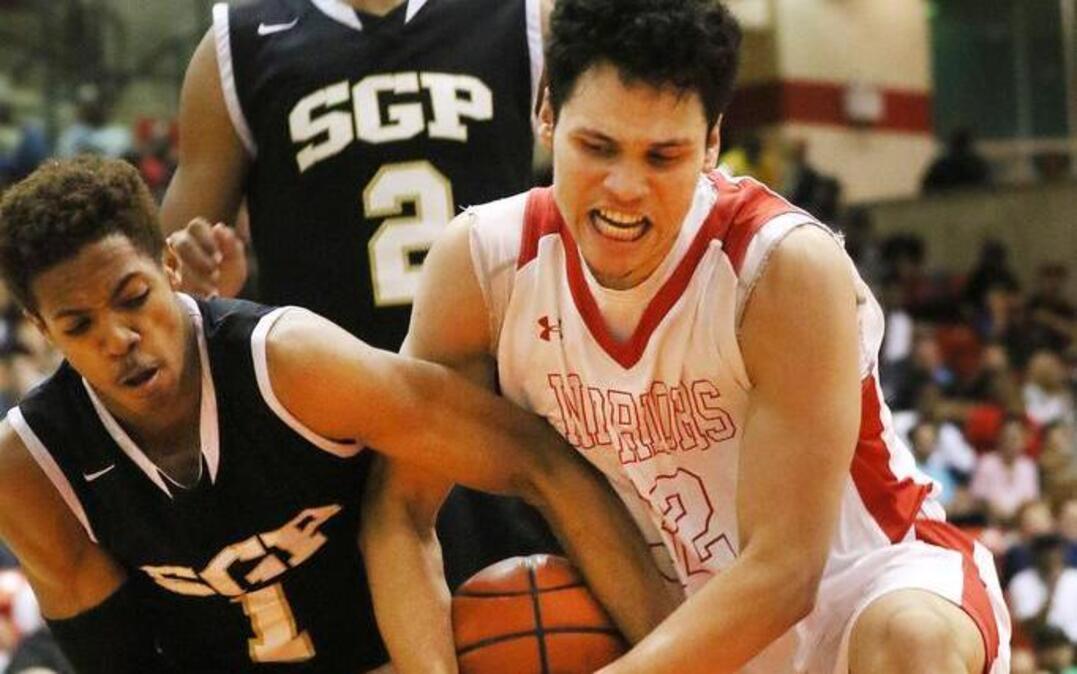 Cameron Massey of South Grand Prairie fights for a lose ball against Deaven Stovall.
