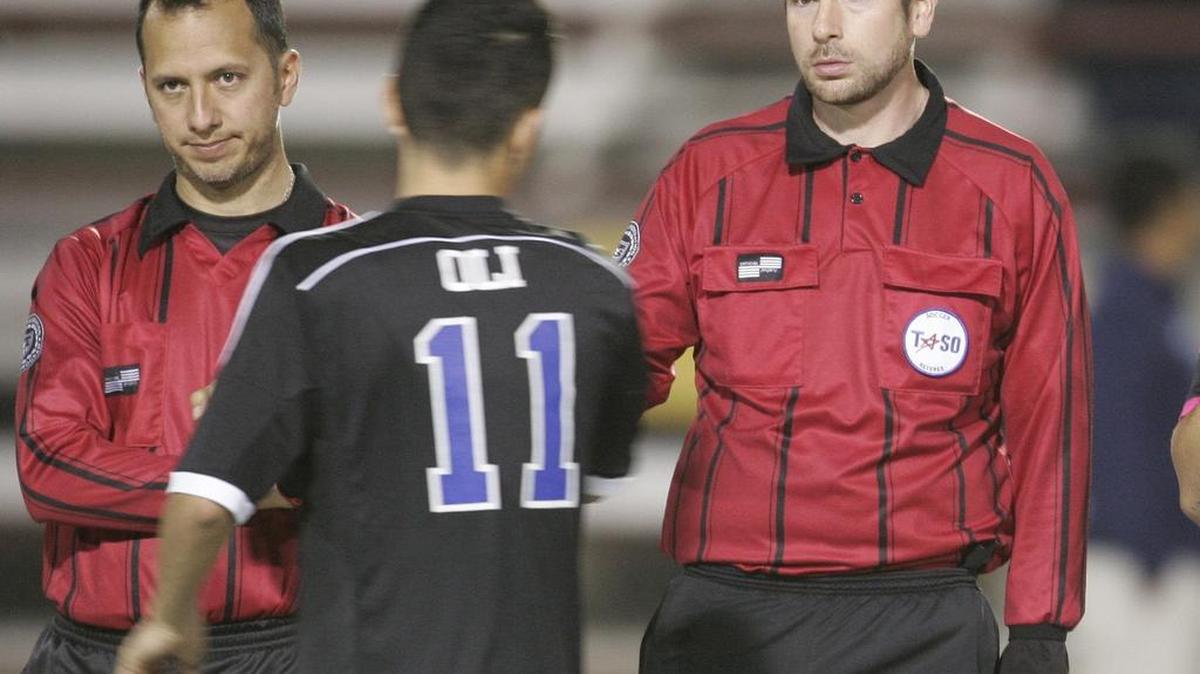 North Crowley midfielder Oliver Villalobos (11) greets officials at the start of a high school soccer game at Lamar High School earlier this month.