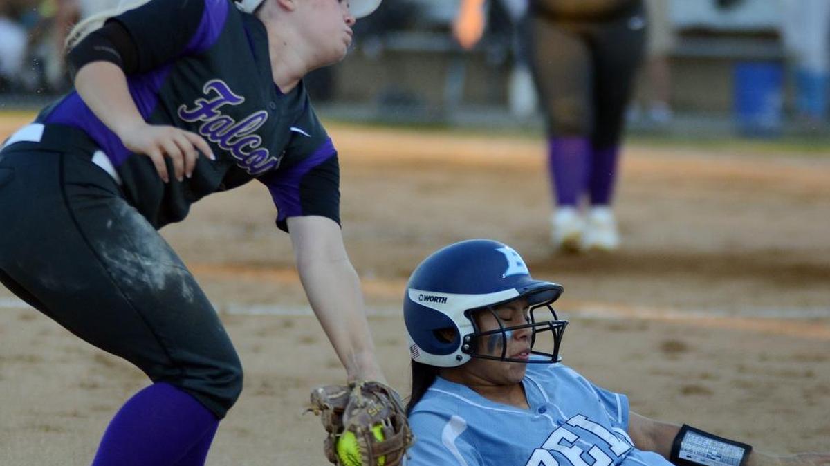 Timber Creek’s third baseman Mattie Davis, left tags L.D. Bell’s Nathalie Concha for an out as she tries to slide into third base in the second inning.