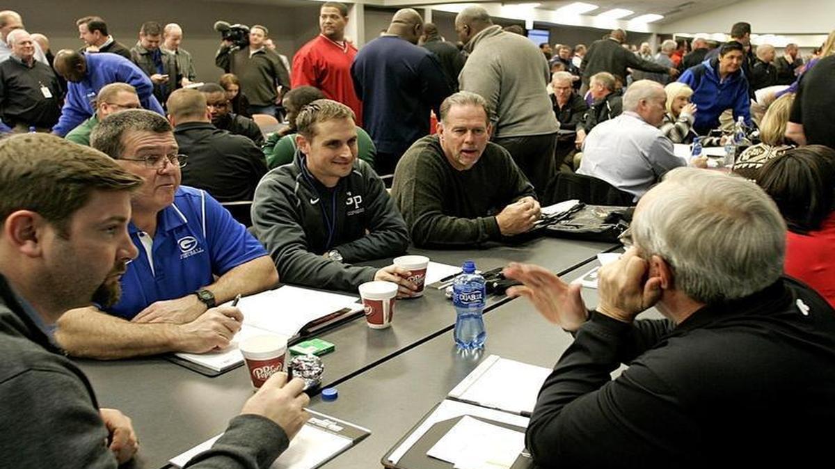 Tables of coaches and athletic directors, like this one in February 2014 with Richland, Granbury and Grand Prairie representatives, will work out their schedules after the UIL football and basketball realignment on Monday.