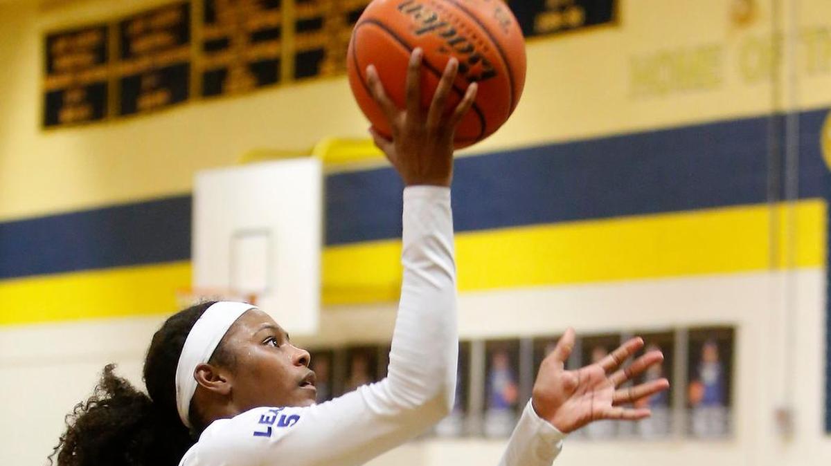 Arlington Heights guard Alexus Seaton goes up for a shot in Tuesday’s game against Trimble Tech, which Heights won 66-57.