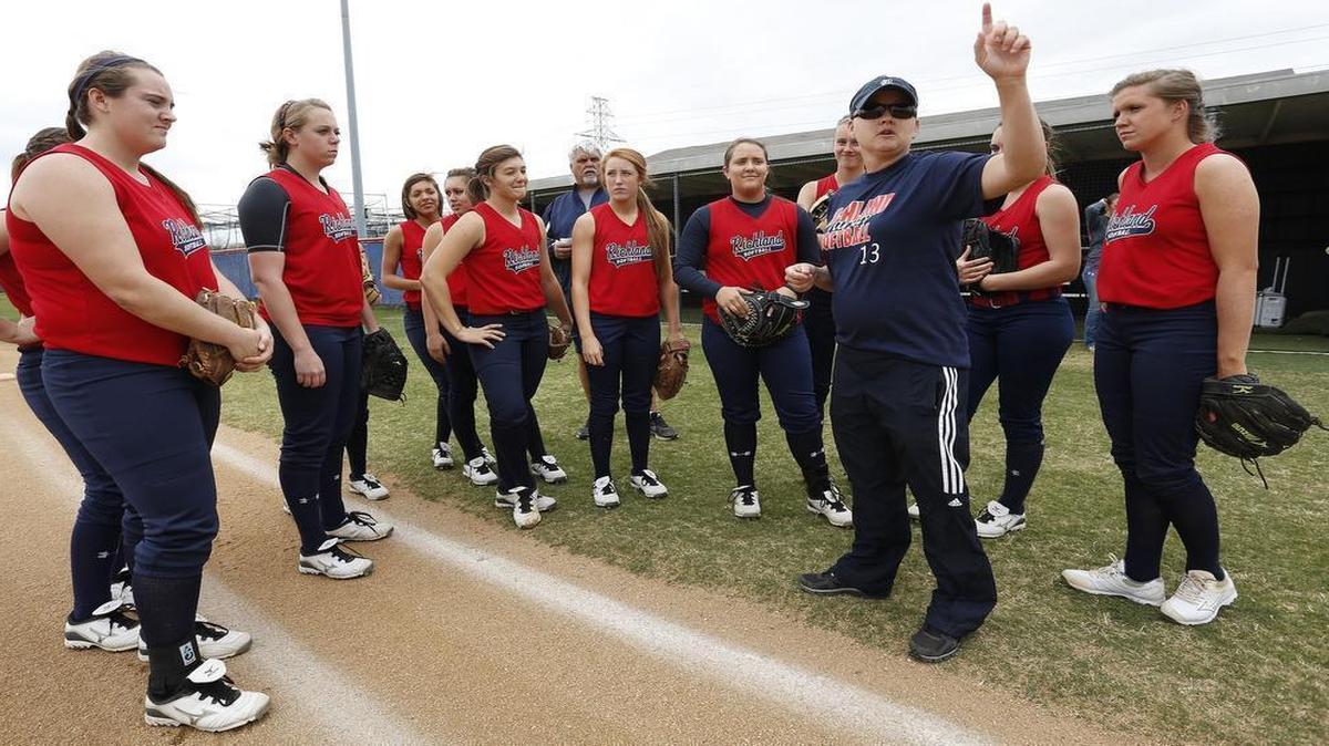
Richland softball coach Brenda Jacobson, right, talking to her team during practice in 2013, has been accused of making racially insensitive comments by some of her players.
