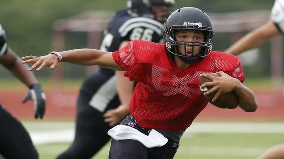 South Hills quarterback Tracin Wallace scrambles during the team’s spring football game in May. Wallace dispelled any doubts in the spring after coming off knee ligament surgery.