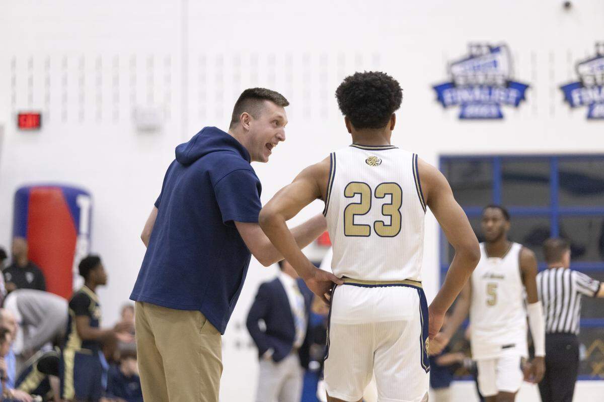 Arlington Grace Prep coach Josh Duke talks to MJ Boyd during the TAPPS Class 5A state championship game against Houston Second Baptist on Saturday at Robinson High School.