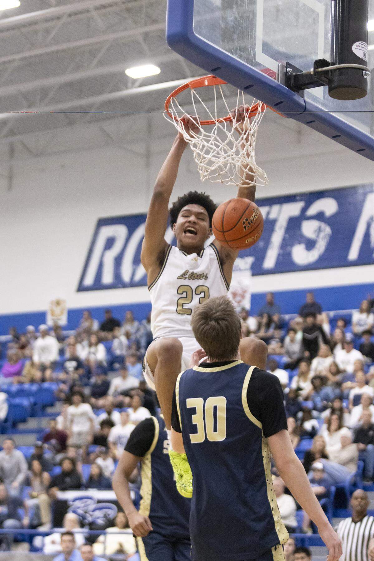 Arlington Grace Prep’s MJ Boyd dunks against Houston Second Baptist in the TAPPS Class 5A state championship game Saturday at Robinson High School.