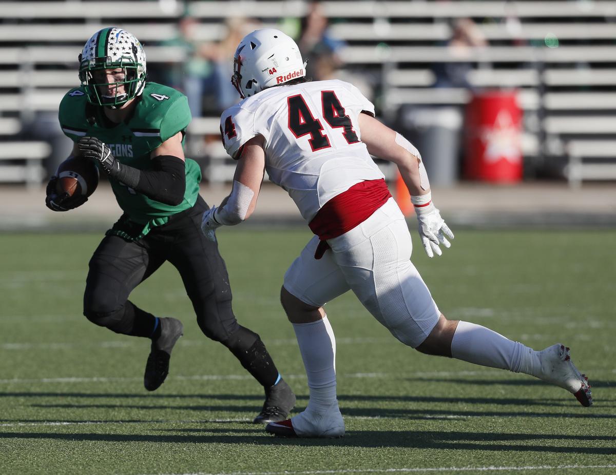 Southlake running back TJ McDaniel (4) attempts to avoid the tackle of Coppell linebacker Walker Polk (44) during the second half of a high school Bi-district football playoff game at Dragon Stadium in Southlake, Texas, Saturday, Nov. 17, 2018. Southlake Carroll defeated Coppell 54-10. (Star-Telegram Bob Booth)