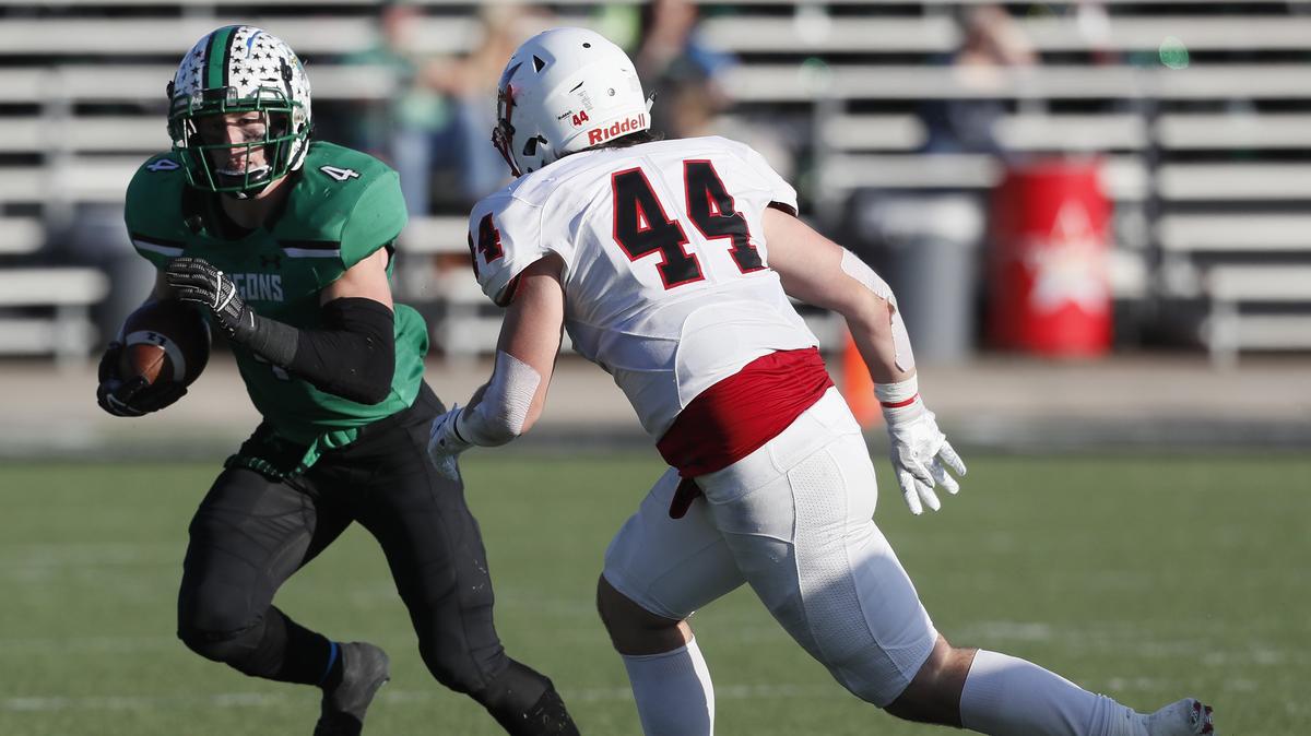 Southlake running back TJ McDaniel (4) attempts to avoid the tackle of Coppell linebacker Walker Polk (44) during the second half of a high school Bi-district football playoff game at Dragon Stadium in Southlake, Texas, Saturday, Nov. 17, 2018. Southlake Carroll defeated Coppell 54-10. (Star-Telegram Bob Booth)
