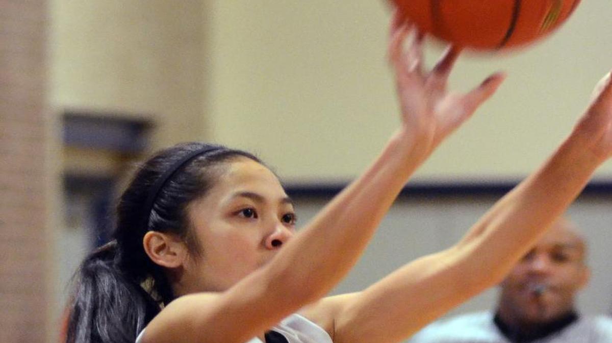 From last season, Haltom guard April Phichitchareunsak takes a long jumper against Burleson.
