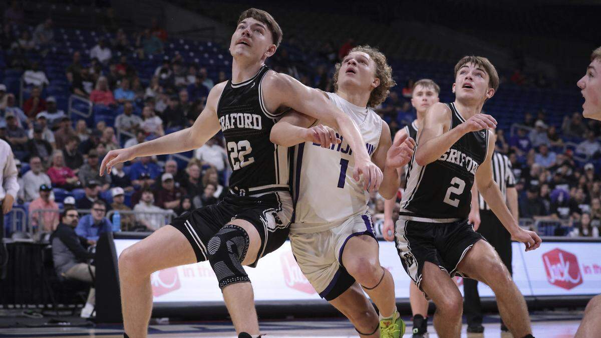 Colin Roberts (22), left, and Christian Shea (2), right, of Graford try to box out Benjamin’s Grayson Rigdon (1), center, in a Class 1A state semifinal on Thursday, March 9, 2023 at the Alamodome in San Antonio, Texas.