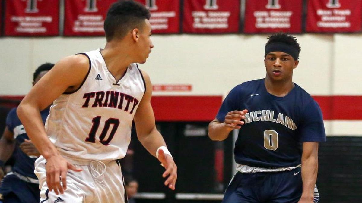 Richland's CJ Roberts (0) dribbles against Trinity's Jhivvan Jackson (10) in a game during the 2015 season.