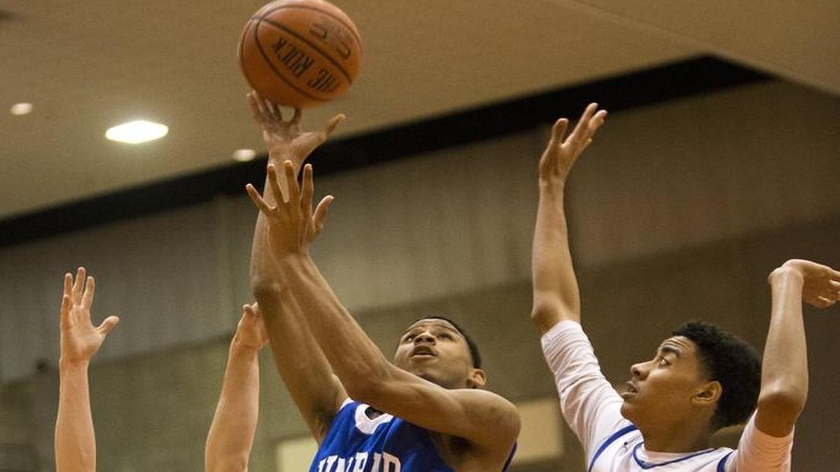 Dunbar’s Jerred Fields (25) shoots during a bi-district playoff game against Brewer, Feb. 23, 2016.