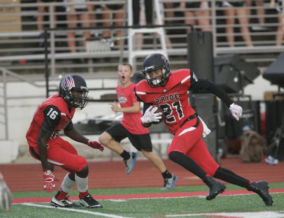 From 2016, Colleyeville Heritage wide receiver Kam Brown (21) takes off up the side lines during a regular-season game.