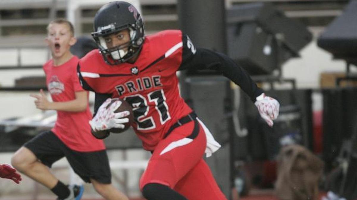From 2016, Colleyeville Heritage wide receiver Kam Brown (21) takes off up the side lines during a regular-season game.