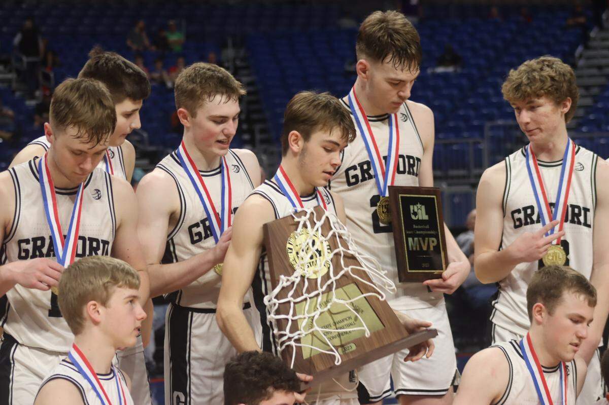 The Graford Jackrabbits admire their hardware after repeating as UIL Class 1A state champions on Saturday, March 11, 2023 at the Alamodome in San Antonio, Texas.