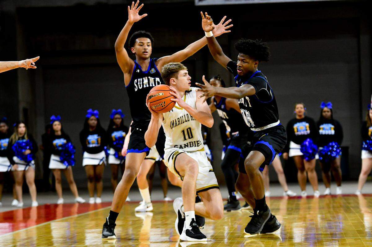 Mansfield Summit’s Franck Emmou (left) and Richard Lemboye (right) trap Amarillo’s Cooper Pillion (center) in a Class 5A Region I semifinal on Friday, March 3, 2023 at the Yeager Coliseum in Wichita Falls, Texas.