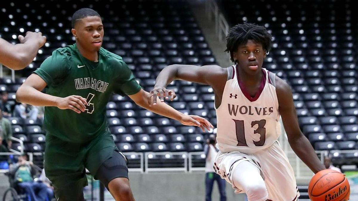 Timberview guard Isaac Likekele (13) drives around Waxahachie guard Xavier Thompson (4) last March. He said an injury was a blessing in disguise.
