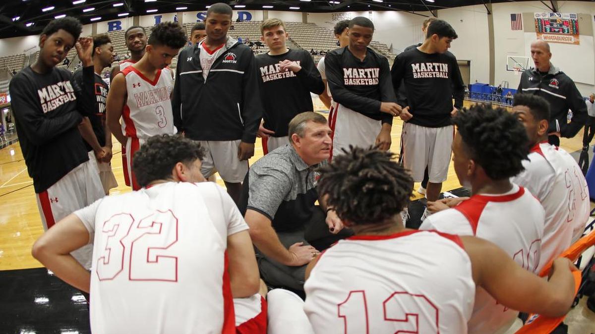 Martin head coach Clint Schnell talks to the team late in the fourth vs. Round Rock McNeil in the Whataburger Orange Division basketball tournament on Wednesday Dec. 28, 2016.