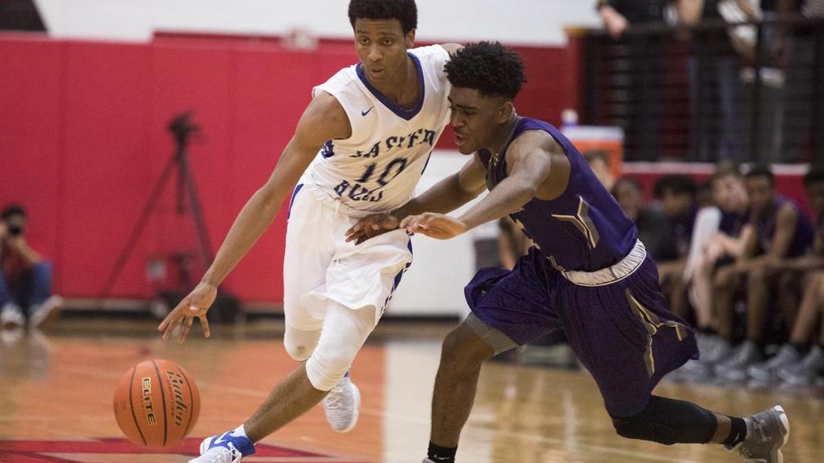 Eastern Hills guard Miguel Encarnacion, left, breaks a press by Chisholm Trail during the 5A Regional Quarterfinals matchup at Colleyville Heritage High School.