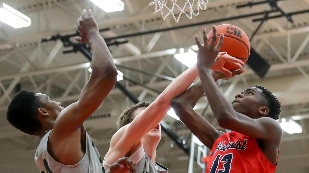 Northwest guard Jordan Keys (13) tries to get off a shot over Birdville's Jalen Adams (24) and Will Sorrells (30) last season.